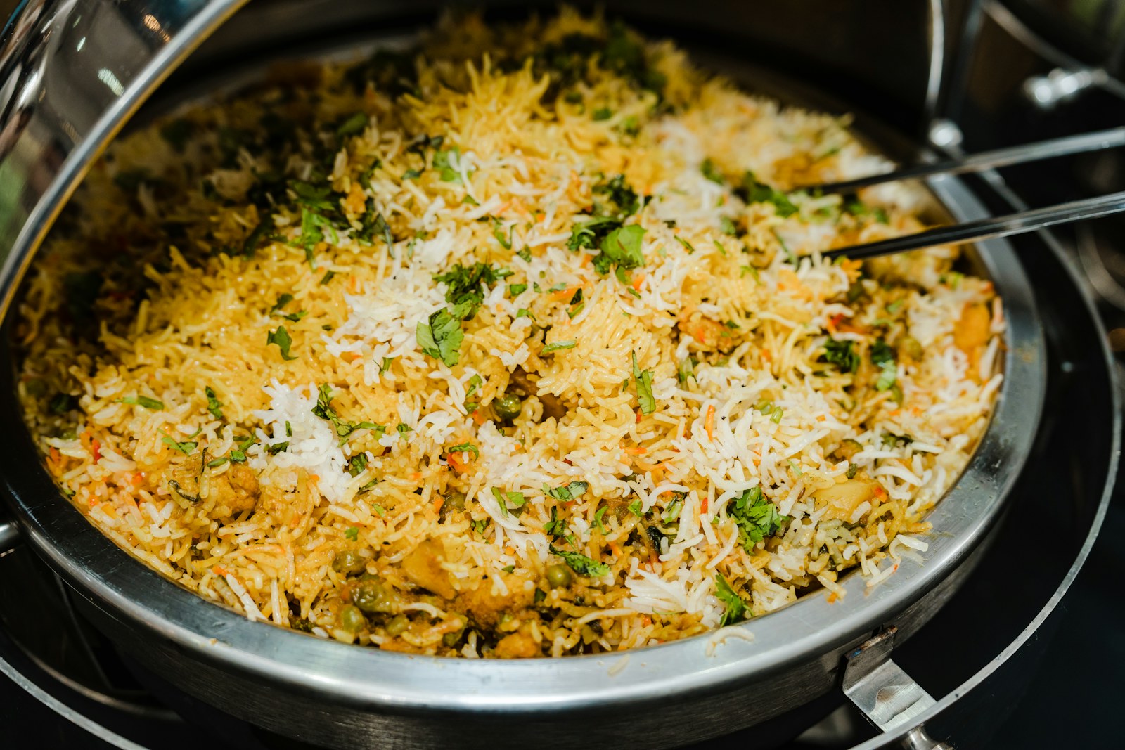 Large degh of biryani prepared for a gathering